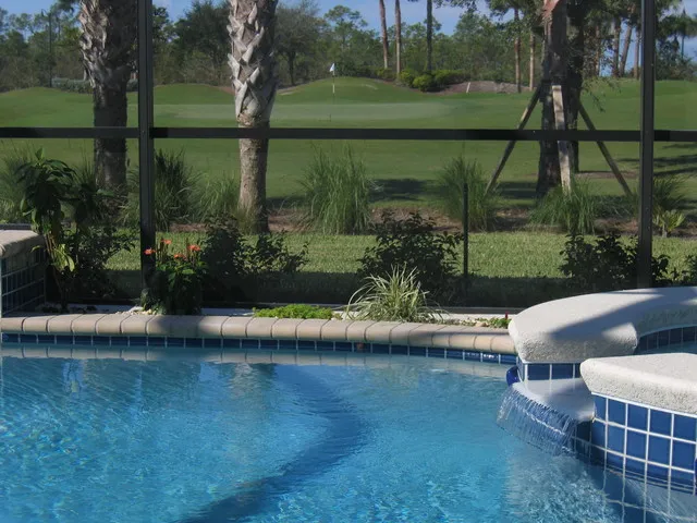 Spa tumbling into the architect designed pool, overlooking the 14th green