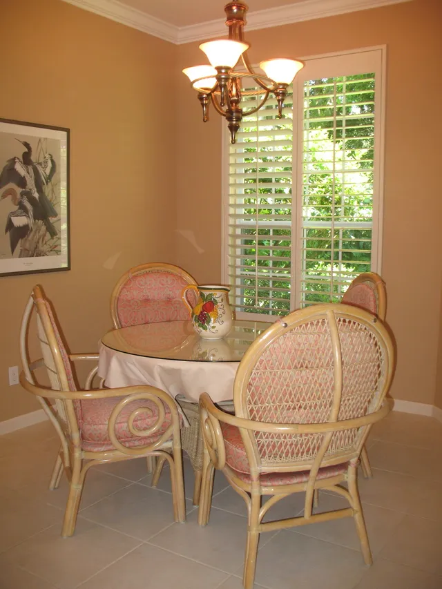 Dining area off kitchen with sliders out to lanai